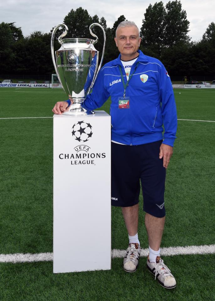 With the Champions League trophy - the original not a copy